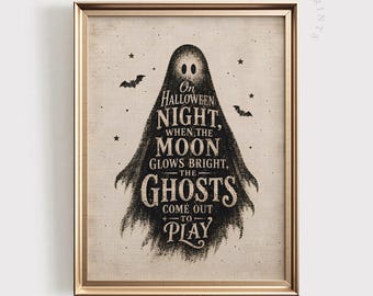 May include: A framed print featuring a black ghost silhouette on a textured beige background. The ghost contains the text: On Halloween NIGHT, WHEN THE MOON GLOWS BRIGHT, THE GHOSTS COME OUT TO PLAY. Small black stars and two bats surround the ghost.