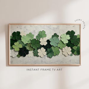 May include: A painting of a cluster of green and white four-leaf clovers on a textured white background. The clovers are arranged in a horizontal row, creating a flowing, organic pattern.