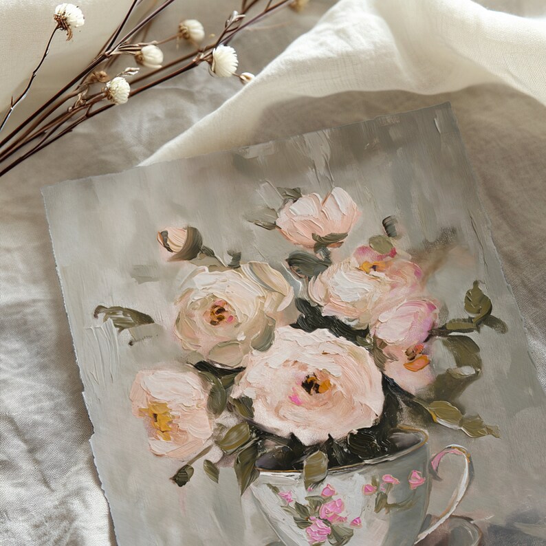 May include: A painting of a bouquet of pale pink roses in a white teacup with a floral pattern. The roses are arranged in a loose, natural style, and the background is a soft gray.