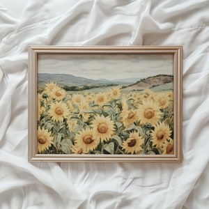 May include: A framed painting depicting a field of sunflowers in full bloom. The sunflowers are yellow with brown centres and green leaves. The background is a hazy landscape with rolling hills.