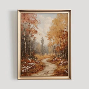 May include: A framed oil painting depicting a winding path through a forest in autumn. The trees are a mix of yellow, orange, and red, and the path is lined with white flowers. The sky is a light blue with white clouds.