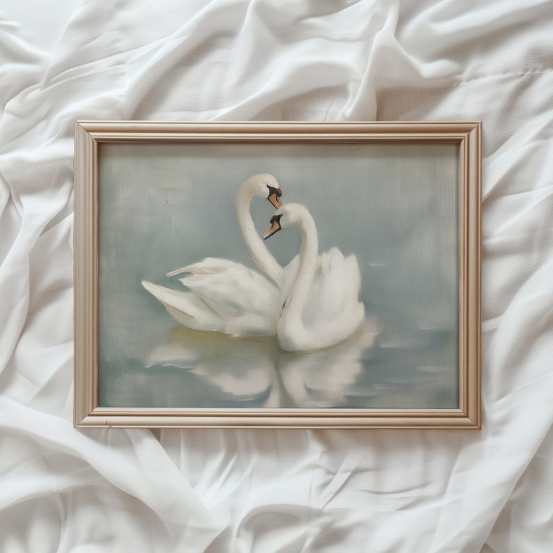 May include: A framed painting of two white swans in a romantic embrace on a blue and gray water background.