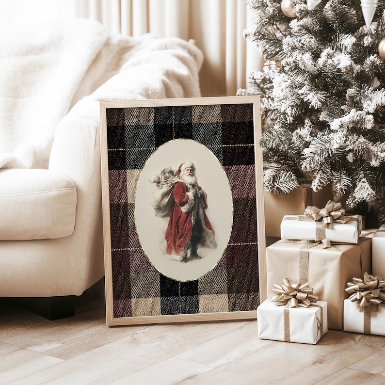 May include: A framed Christmas print featuring Santa Claus carrying a sack. The image of Santa is set in an oval frame against a plaid background of black, brown, and beige. The print is displayed near a Christmas tree and wrapped gifts.