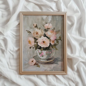May include: A framed painting of a bouquet of pale pink roses in a vintage teacup. The roses are arranged in a delicate cluster, with their petals unfurling in a soft, romantic style. The teacup is decorated with a floral pattern and sits on a saucer.