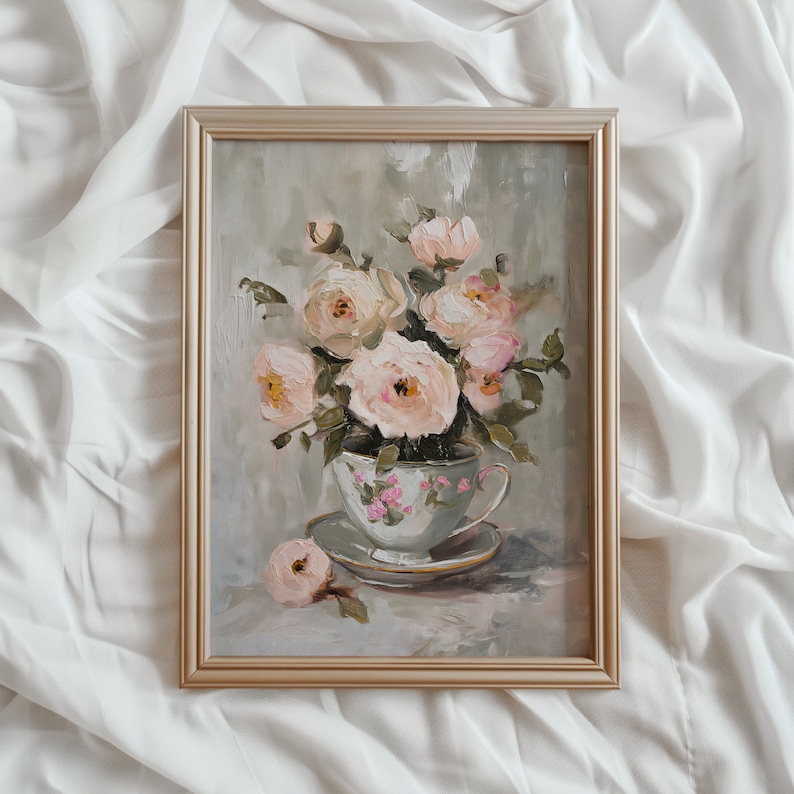 May include: A framed painting of a bouquet of pale pink roses in a vintage teacup. The roses are arranged in a delicate cluster, with their petals unfurling in a soft, romantic style. The teacup is decorated with a floral pattern and sits on a saucer.
