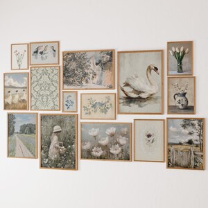 May include: A collection of framed art prints in various sizes and styles. The artwork includes floral, landscape, and animal themes, with a focus on soft colors and vintage aesthetics. The frames are made of light-colored wood.