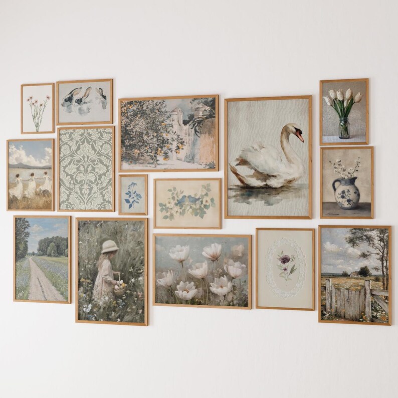 May include: A collection of framed art prints in various sizes and styles. The artwork includes floral, landscape, and animal themes, with a focus on soft colors and vintage aesthetics. The frames are made of light-colored wood.