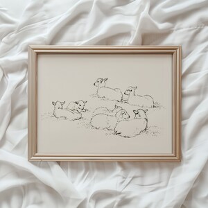 May include: A black and white line drawing of a group of sheep in a framed print. The sheep are all lying down in a field.
