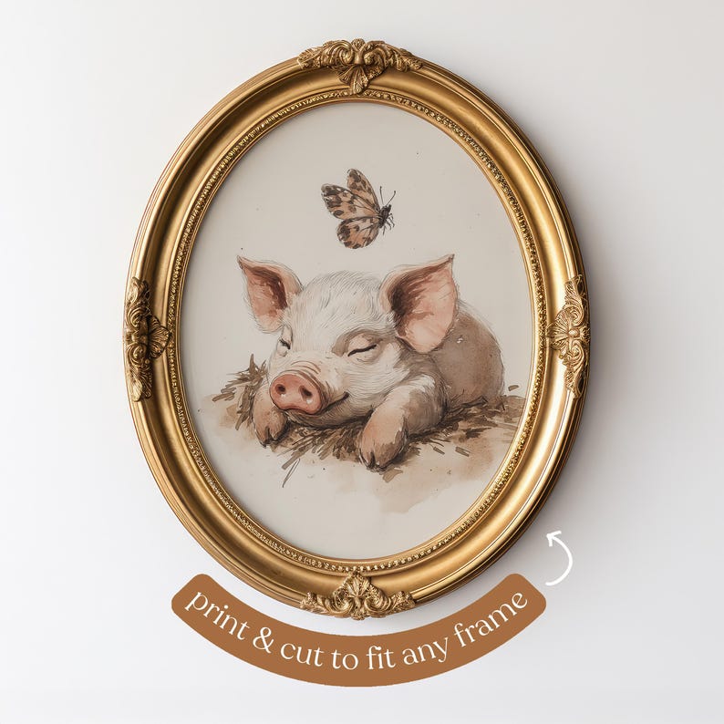 May include: Oval gold frame with a watercolor print of a sleeping piglet and a butterfly. The piglet is light pink and brown, resting on hay. The frame has ornate detailing and is set against a white background.