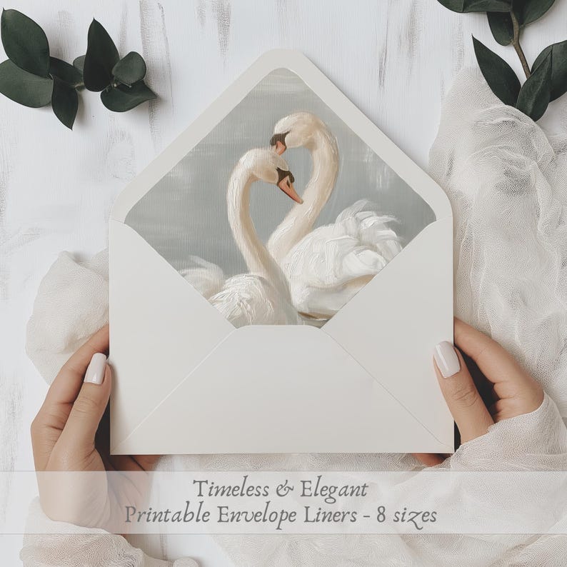 May include: Printable envelope liners featuring a watercolour painting of two white swans with their necks intertwined. The text "Timeless & Elegant Printable Envelope Liners - 8 sizes" is at the bottom of the image.