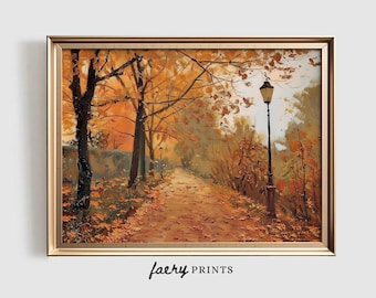 May include: A framed oil painting depicts an autumn park scene. The artwork features a path lined with trees in shades of orange and brown, with fallen leaves. A black lamppost stands on the right. The text "faery PRINTS" is at the bottom.