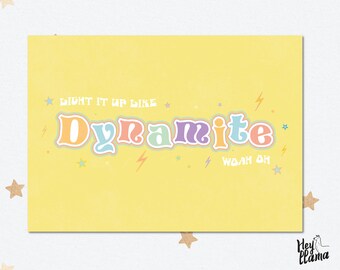 May include: A yellow background with the text "Light it up like Dynamite" in rainbow colours with stars and lightning bolts. The text "Woah oh" is in smaller font below the main text.