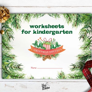 May include: A printable worksheet for kindergarten students featuring a Christmas theme. The worksheet has a green pine branch border and a red and white striped gift box with a green bow. The text "worksheets for kindergarten" and "Christmas Edition" are printed on the worksheet.