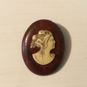 Antique Wood Base Cameo - Right facing. -  The cameo looks to have a Ghost clip in her hair.  Perfect for the Cameo Lover / Collector