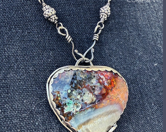 Alchemist’s Heart - Colorful Opalized Petrified Wood pendant set in Sterling Silver with fire and water elements on reverse - Front Hook