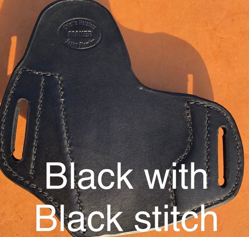 May include: Black leather holster with black stitching. The holster has a maker's mark that reads "Mayer's Holster, Mayer, Made in USA".
