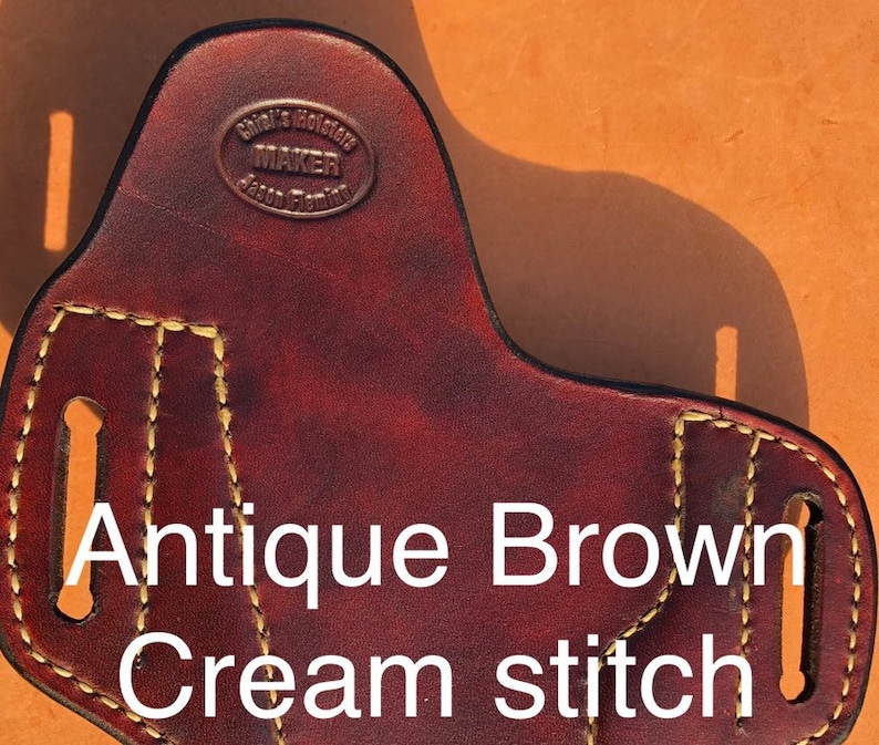 May include: Antique brown leather holster with cream stitching. The holster has a maker's mark that reads "Chief's Holster Maker Jason Fleming".