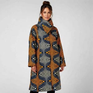 May include: A long coat featuring a high collar and a striking geometric design in orange, blue, black, and white. The coat has long sleeves and a straight cut, ideal for colder days.