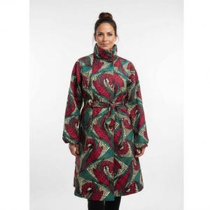 May include: A long coat with a vibrant pattern of red, green, and cream swirls. The coat features a high collar, long sleeves, and a matching belt tied at the waist. The coat is knee-length and appears to be made of a patterned fabric.