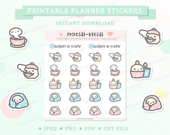 May include: Printable planner stickers featuring cute cartoon characters in wintery scenes. The stickers include characters wearing hats and scarves, holding mugs of hot drinks, and wrapped in blankets. The stickers are designed in a pastel color palette with pink, blue, and yellow accents. The text "Warm & Cozy" is featured on the sticker sheet.
