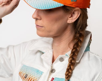 Cappellini New Era in pitone, giacche Levi's in pitone