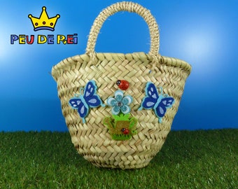 Esparto basket with sprinkler, butterflies and blue flower