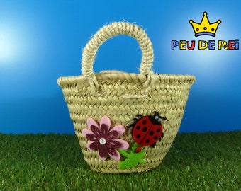 Esparto basket with ladybug and pink flower