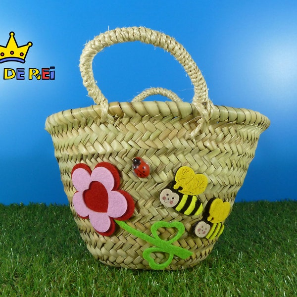 Esparto grass basket with bees and pink flower