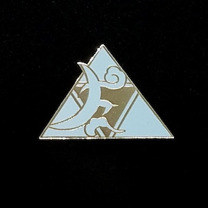 May include: A light blue and gold enamel pin in the shape of a triangle. The pin features a stylized design of a crescent moon and clouds. The pin has a gold border and is set against a black background.