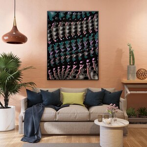 May include: A living room scene with a beige sofa, navy blue throw pillows, and a yellow pillow. A large abstract art piece hangs above the sofa. A potted palm tree and a pendant light are also visible.