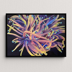 May include: Abstract painting of a vibrant, coral-like form in shades of yellow, orange, and purple, with small blue orbs. The artwork is set against a black background and framed in a black frame.