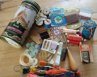 An interesting collection of mainly vintage haberdashery in  Harrods tin. Sewing notions. Anchor thread, bobbins, Newey fastners,Sylko Coats