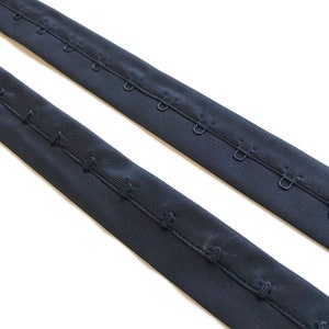 Black, White Hook and Eye trim with 1&quot; poly tape(Selling per yard: not running yards)