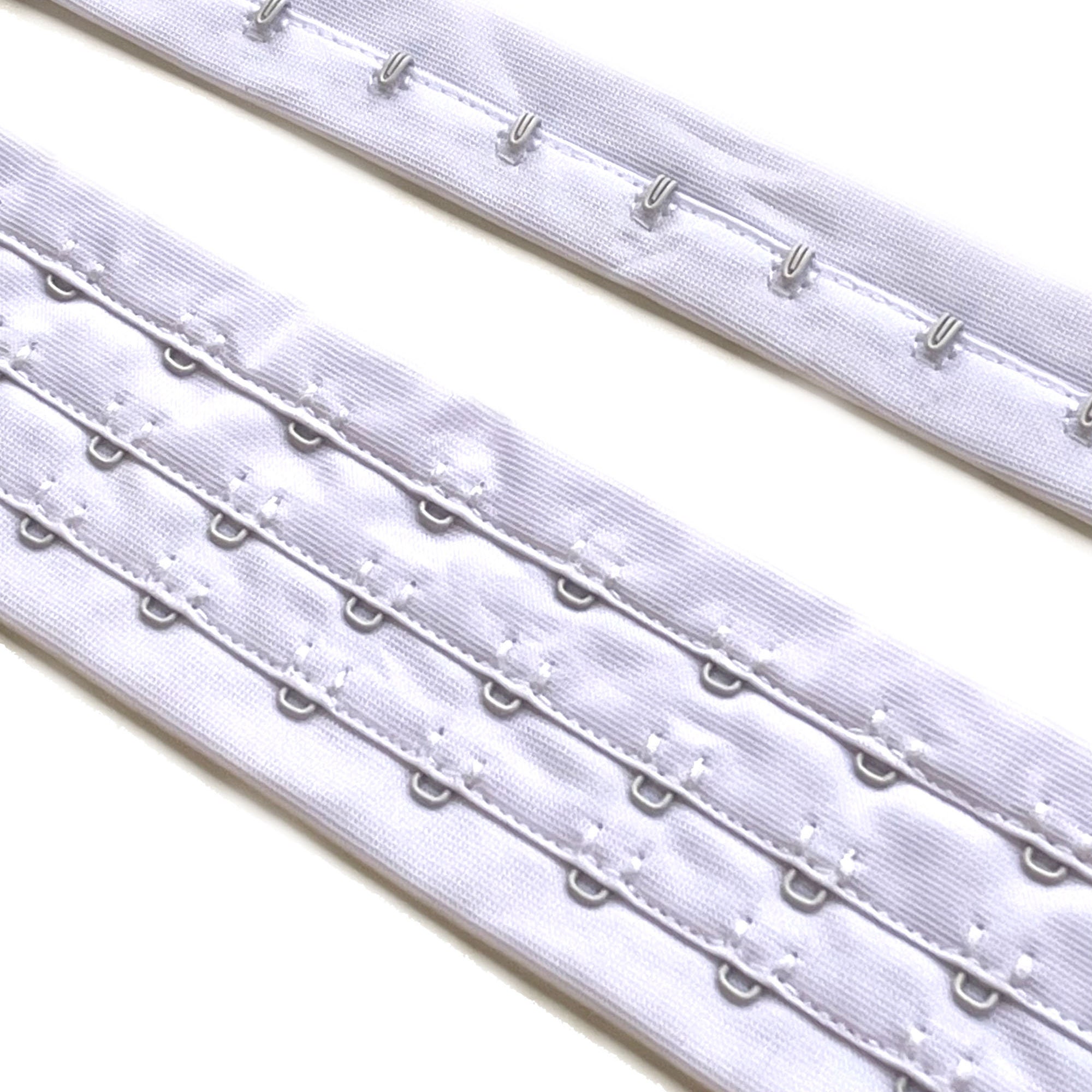 3 rows of eyes Hook and Eye tape Black (Selling per yard) TRIM BASIC 11