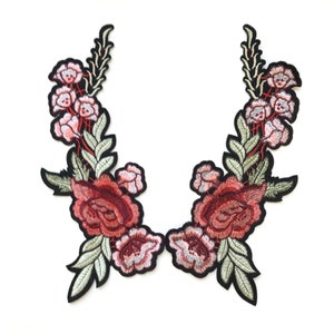 May include: Two embroidered floral appliques with red and pink roses and green leaves. The appliques are perfect for adding a touch of elegance to clothing, bags, or home decor projects.