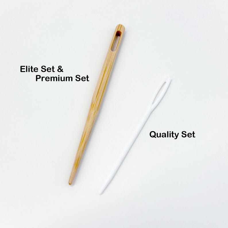 May include: Two needles are displayed against a white background. One is a light brown, wooden needle with the text "Elite Set & Premium Set". The other is a white plastic needle with the text "Quality Set".