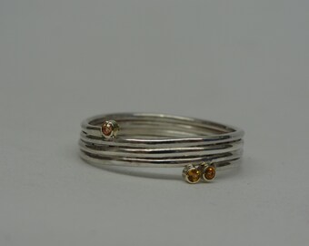 Silver twisted ring with golden zetkasten and sapphires.