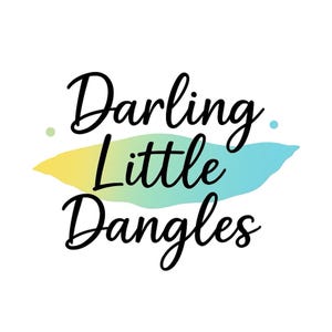 May include: The words "Darling Little Dangles" in elegant black script are displayed on a white background. A colorful, abstract shape in yellow and blue gradients is behind the text.