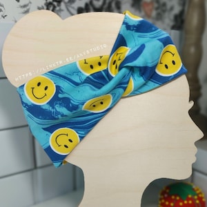 Smiley face Print Turban Style Headband. Adult. Scroll down to read item details