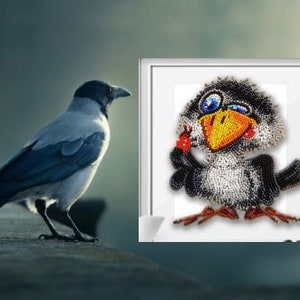May include: A framed beaded artwork of a cartoon bird with a black and white body, a yellow beak, and blue eyes. The bird is winking and has a red bead on its wing.