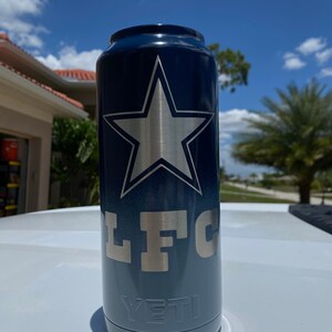 May include: A blue and gray Yeti Rambler with a silver star and the letters "LFC" on the side.
