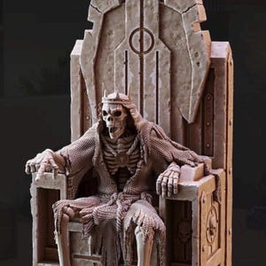 May include: A detailed sculpture of a skeletal figure seated on a stone throne. The figure wears a crown and tattered chainmail. The throne is intricately carved with a circular design and skull details, showcasing a gothic or fantasy theme.