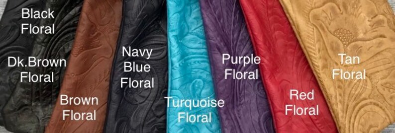 May include: A collection of embossed leather samples in various colors, including black, dark brown, brown, navy blue, turquoise, purple, red, and tan. Each sample features a floral pattern and is labeled with its color and the word "Floral".