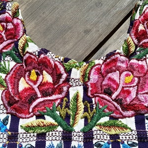 Huipil (Guatemalan blouse) with roses and birds, hand embroidered on hand woven fabric.