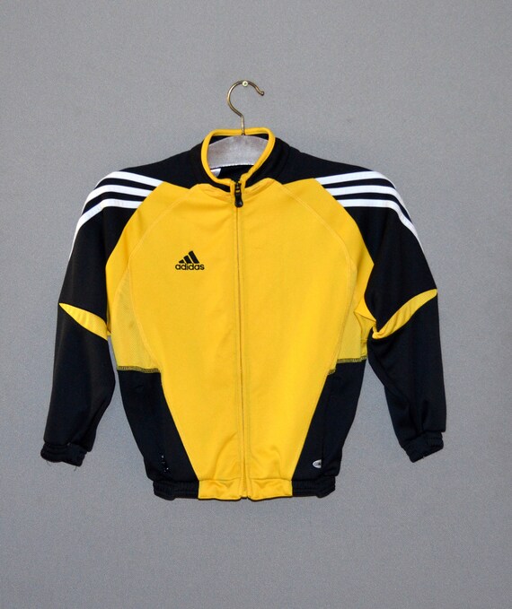 yellow tracksuit with black stripe