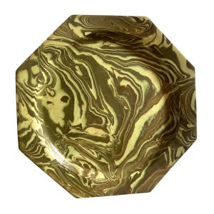 May include: An octagonal tray featuring a marbled pattern of swirling dark brown and light yellow-green colors. The surface has a smooth, glossy finish with distinct, flowing lines that create a complex, organic design across the entire object.