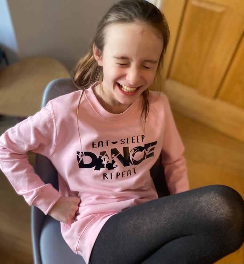 In sizes 3-13 years Dance Sweatshirt Baby Pink Dancewear for keeping warm on way to studio Maybe out with friends whilst limbering up