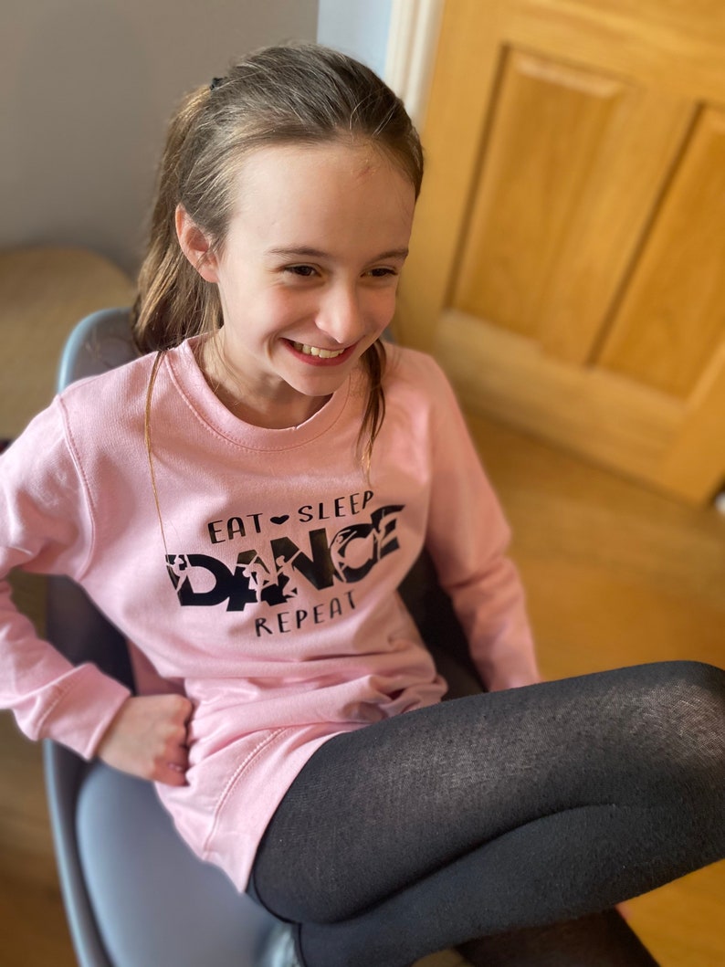 In sizes 3-13 years Dance Sweatshirt Baby Pink Dancewear for keeping warm on way to studio Maybe out with friends whilst limbering up