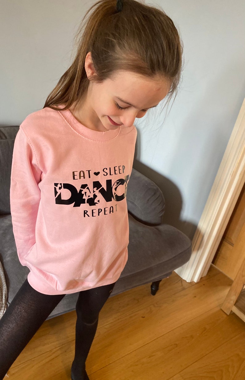 In sizes 3-13 years Dance Sweatshirt Baby Pink Dancewear for keeping warm on way to studio Maybe out with friends whilst limbering up