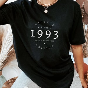 May include: Black t-shirt with white text that reads "Vintage Since 1993 Aged & Authentic Edition".